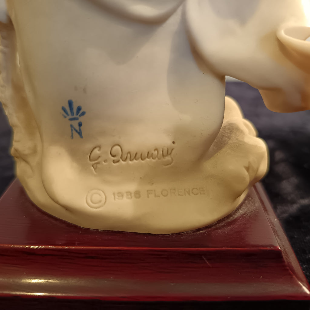 A pair of Capademonte figurines Winter & The country boy by G Armani