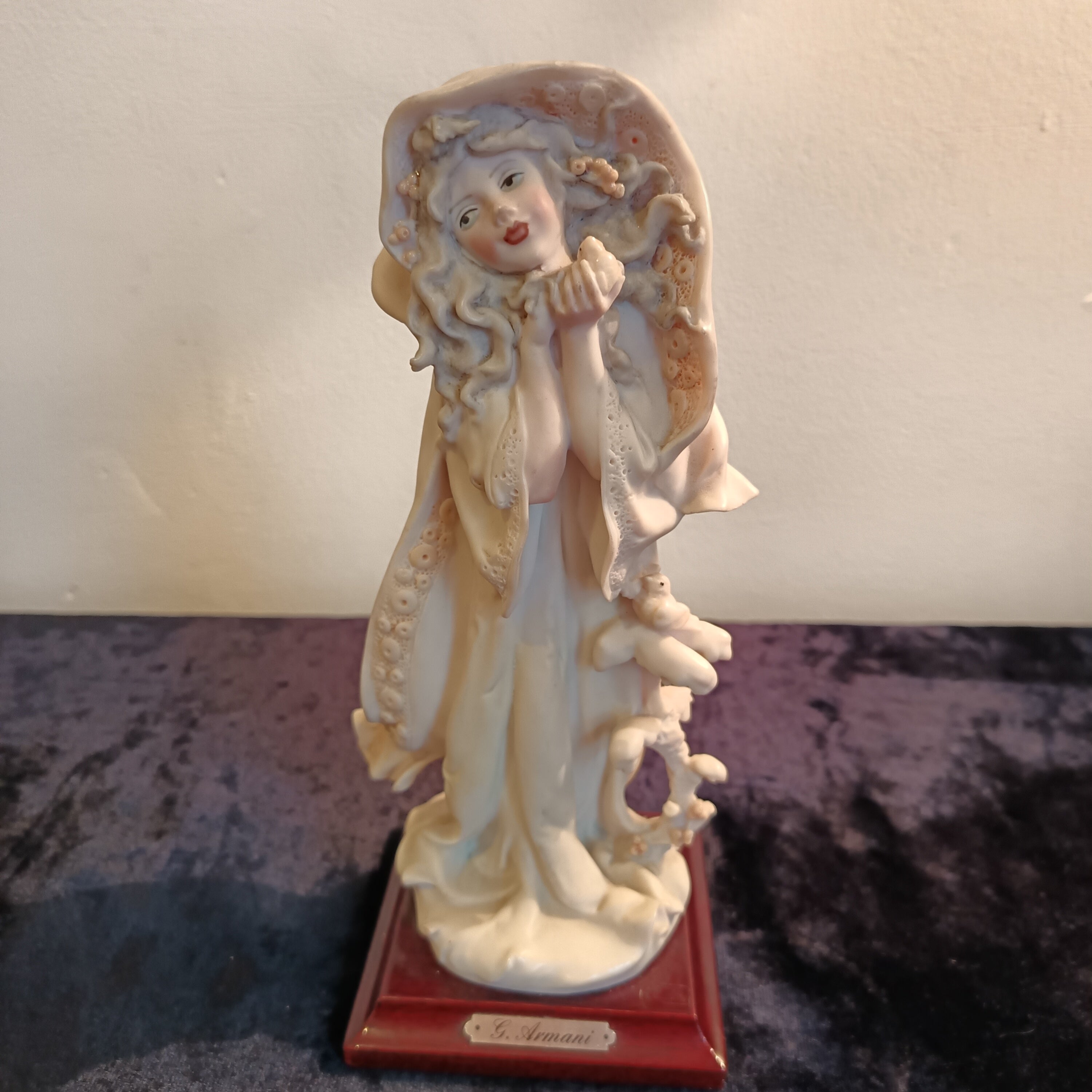 A pair of Capademonte figurines Winter & The country boy by G Armani