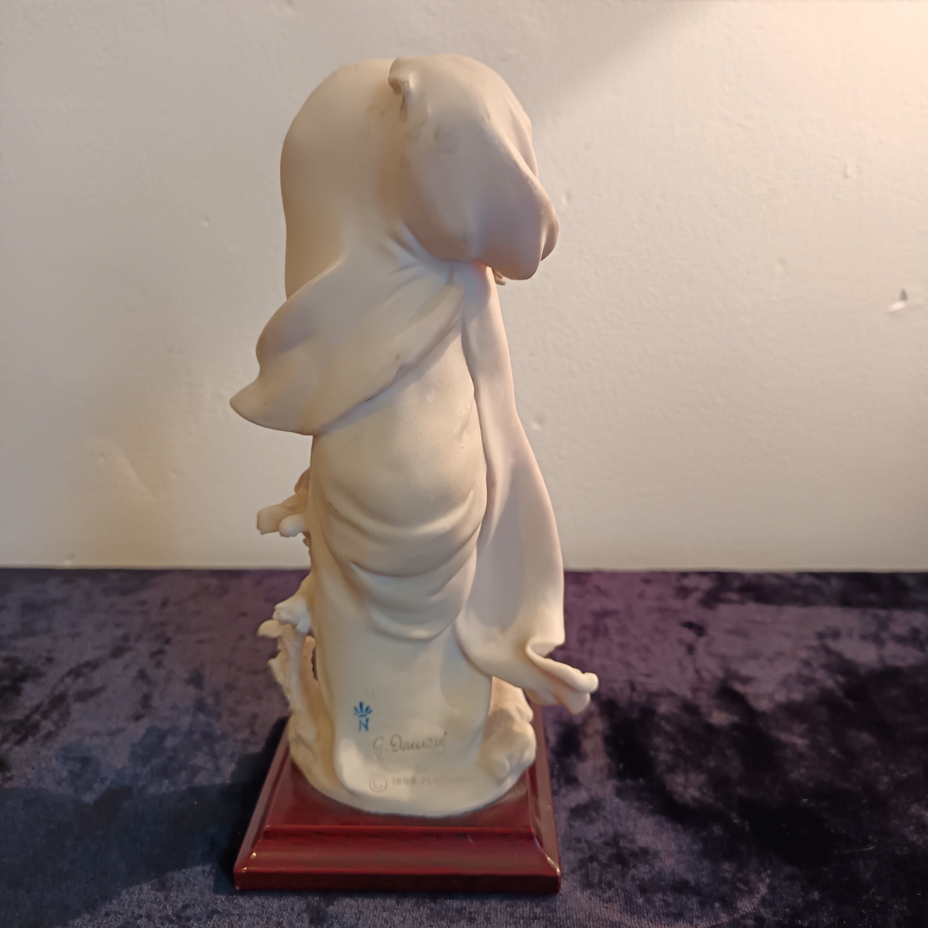 A pair of Capademonte figurines Winter & The country boy by G Armani