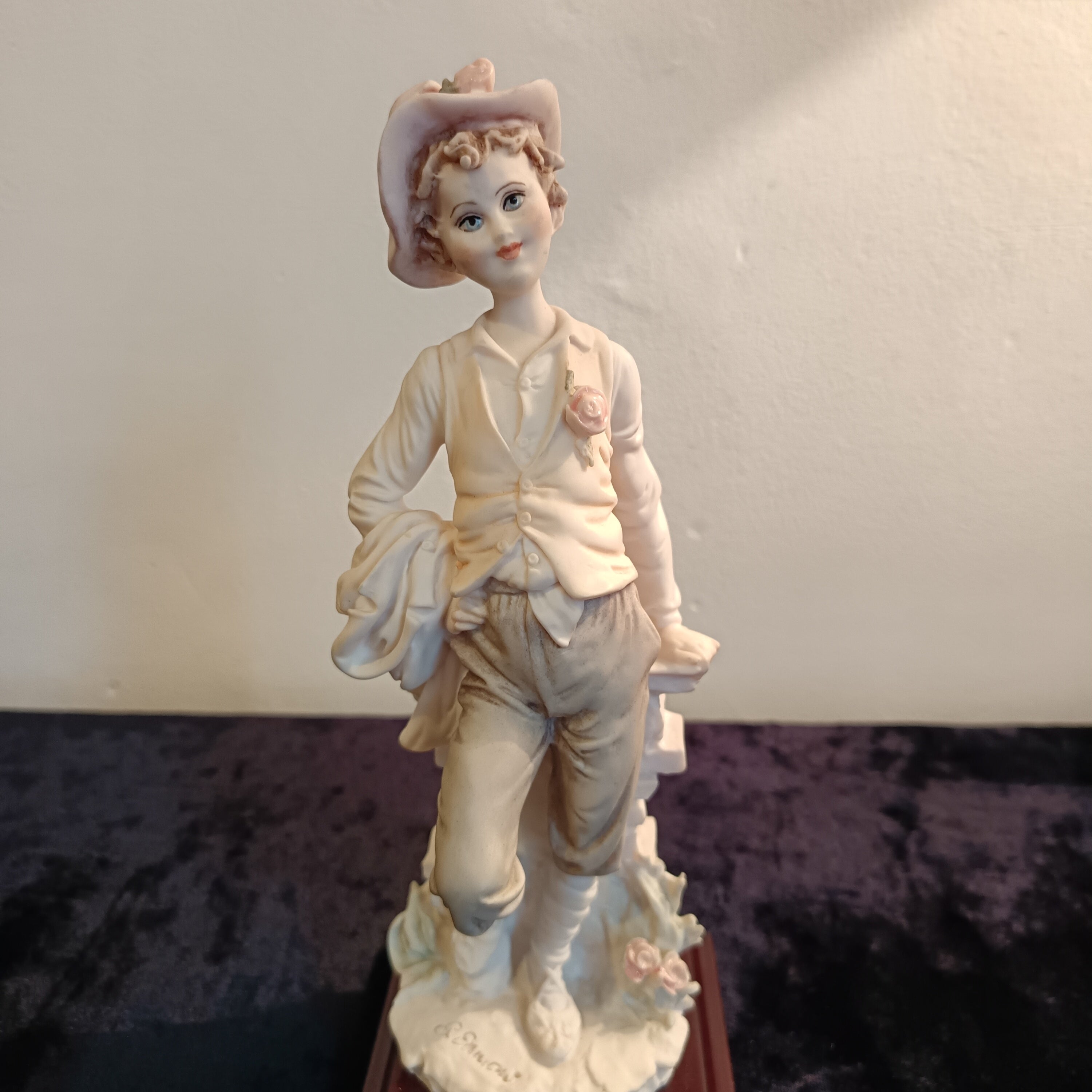 A pair of Capademonte figurines Winter & The country boy by G Armani
