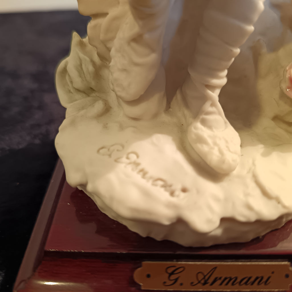 A pair of Capademonte figurines Winter & The country boy by G Armani