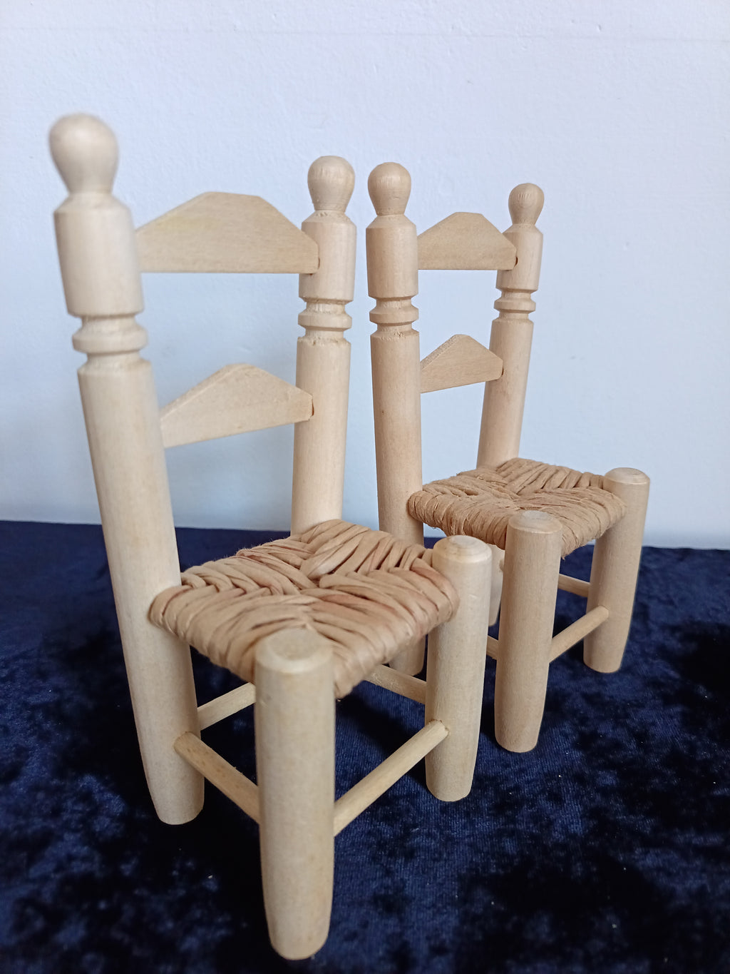 Vintage-style miniature Dolls wooden woven seat chairs.